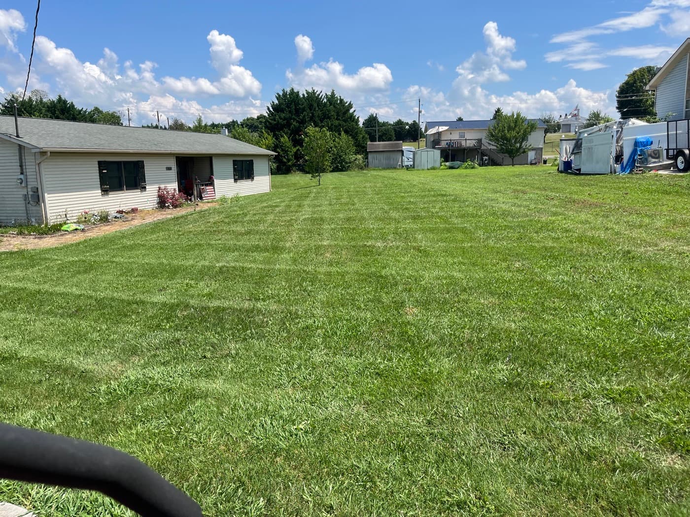 Large rural East Tennessee property freshly mowed with open green lawn